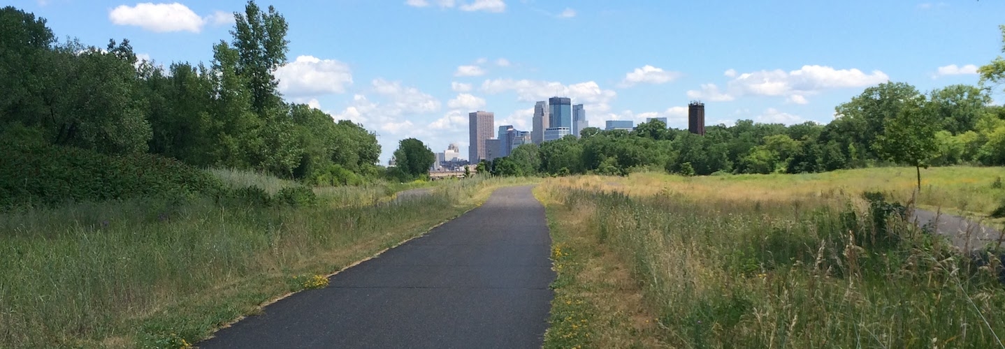 A trail and the Minneapolis skyline, photo by Dan Soneson, former director of the Language Center.