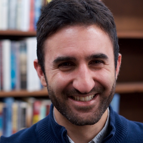 Arash Davari, a person with short, dark brown hair a beard and mustache