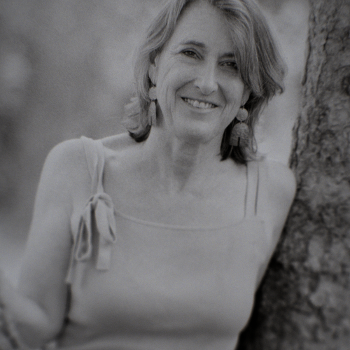 image of Prof. Sonja Kuftinec leaning against tree