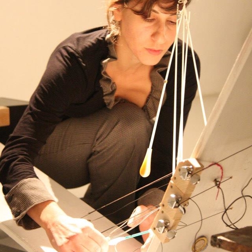Sivan Cohen Elias during a performance on invented musical instrument