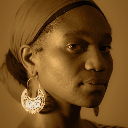 portrait image showing the face of Chotsani Elaine Dean a Black woman in sepia tone