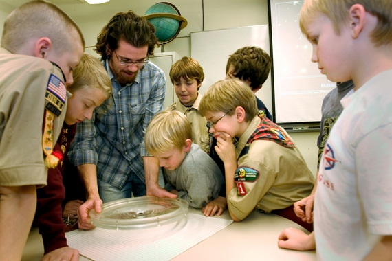 A University instructor leads a presentation for a group of Boy Scouts