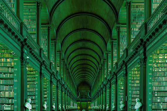 A view of the Long Library at Trinity College Dublin. The image has a green filter over it. 