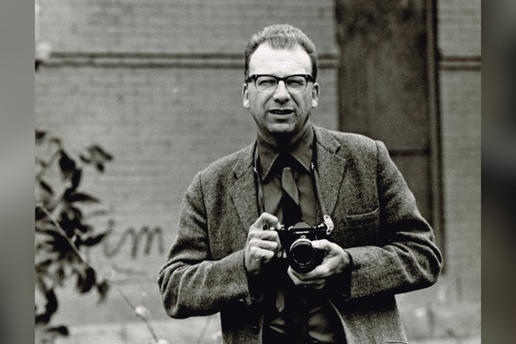 Luther Gerlach holding a camera.