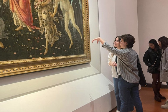 Photo of students at the Uffizi gallery looking at a Botticelli painting