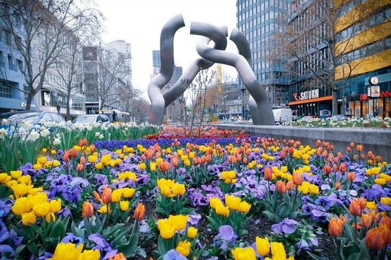 Outdoor sculpture in Berlin with flower garden in the foreground