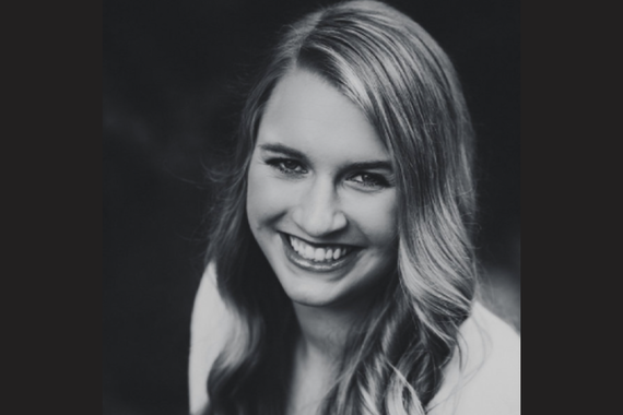 woman, shoulder length blonde hair, white jacket, black & white photo