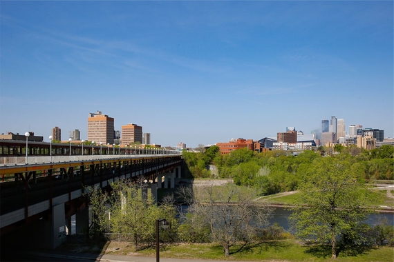 The UMN West Bank campus skyline from across the Mississippi River