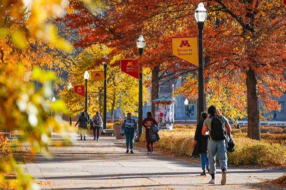 Students walk through Northrop Mall in the fall