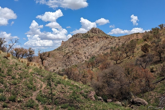 A mountain against a blue sky