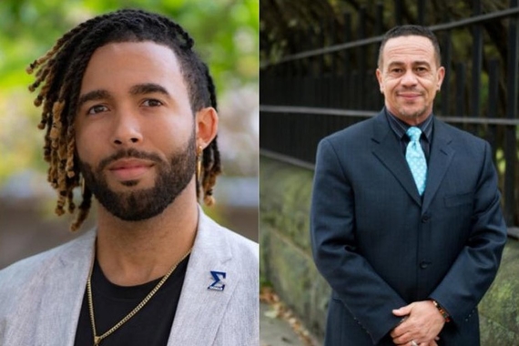 MLK Program Director Alexander Hines, a Black man in a navy suit, and Associate Director Evan Johnson, a Black man in a gray blazer
