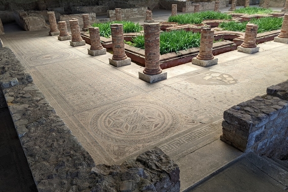 Preserved interior courtyard of a Roman villa on an archaeological site in Portugal.