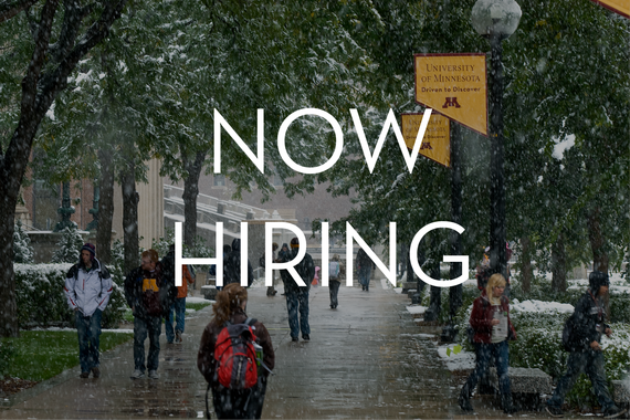 The words "now hiring" over an image of students walking down a lightly-dusted path on campus.