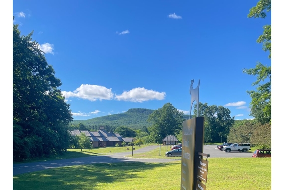 View of Yiddish Book Center in Amherst, Massachusetts on sunny day in background with Holyoke Range in view