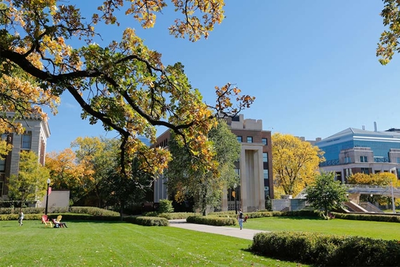 A summer scene of Ford Hall on the Northrop Mall