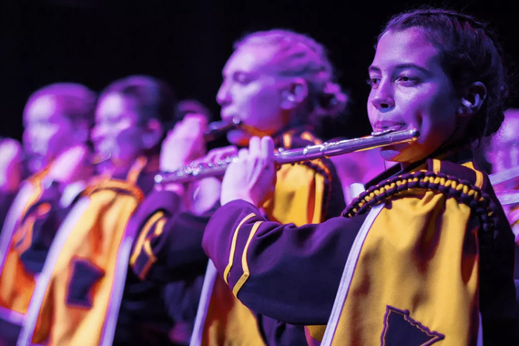 Marching Band students play flute