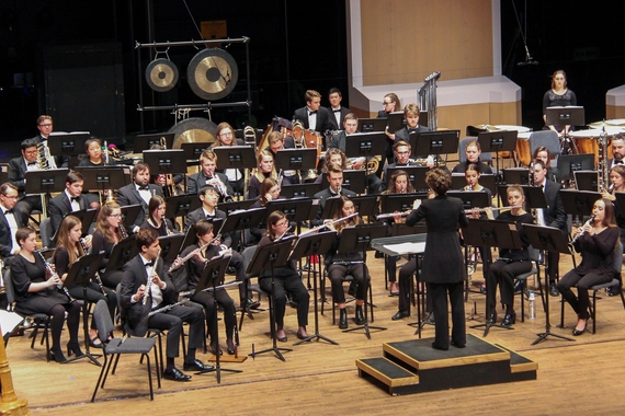 University Wind Ensemble playing on stage during a concert