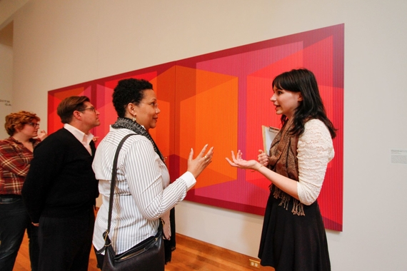 Photo of a student giving a tour at the Weisman art museum.