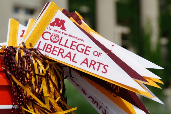 College of Liberal Arts pennants, a maroon pompom, and beads