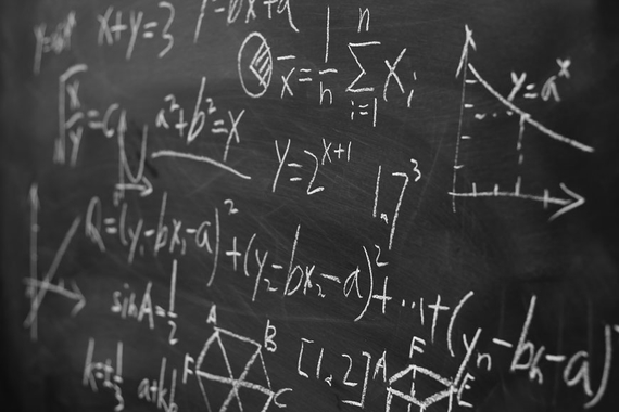 Chalkboard with mathematic formulas written on it