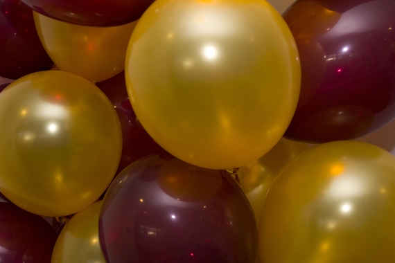 Maroon and gold balloons
