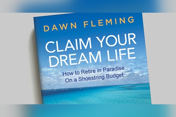 Book with the title "Claim Your Dream Life"