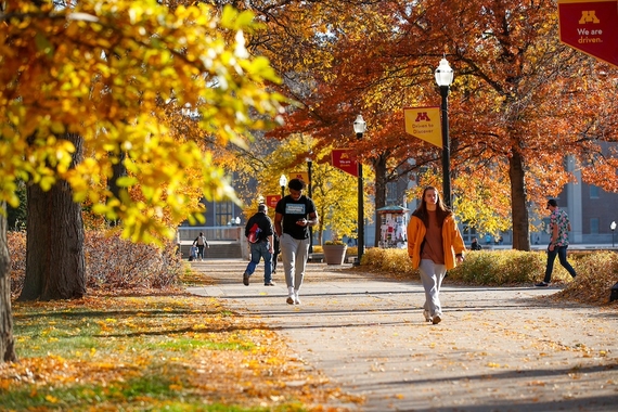 People walking on Northrop Mall on a fall day