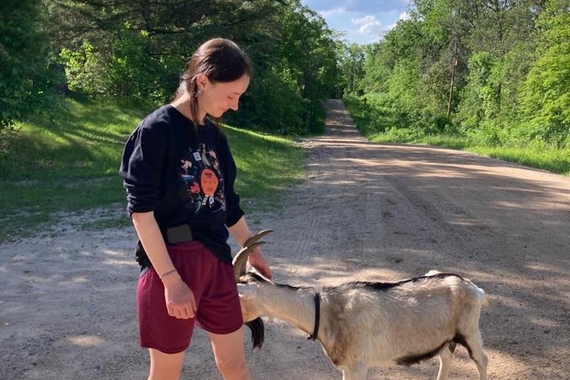 Isabel Huot-Link (MHR '23) with a goat