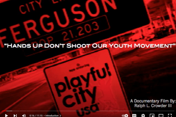 City of Ferguson population sign with the words "Hands Up Don't Shoot Our Youth Movement"