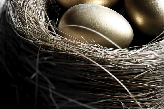 Three golden eggs in a nest