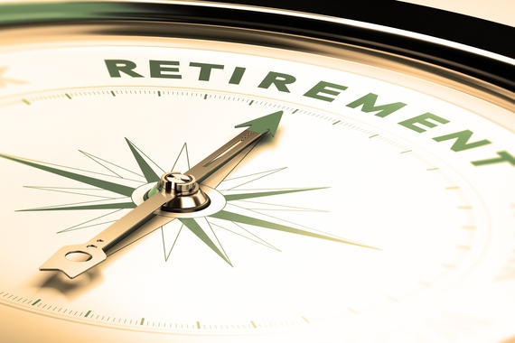 Close up of compass with arrow pointing at the word retirement