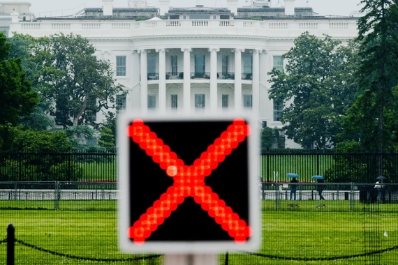 Electronic with red X positioned in front of the White House.