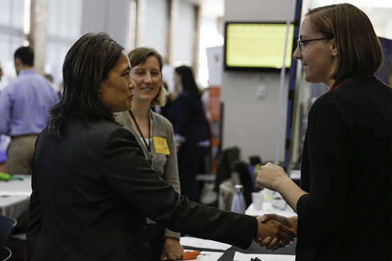 Employer and student shaking hands at Career Fair