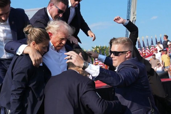 Trump is encircled by members of the Secret Service after an assassination attempt in July