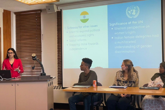 Student Manasi Nagargoje gives her presentation alongside a student panel of (left to right) Lemuel Samuel, Chloe Carstensen and Salma Abdi.  