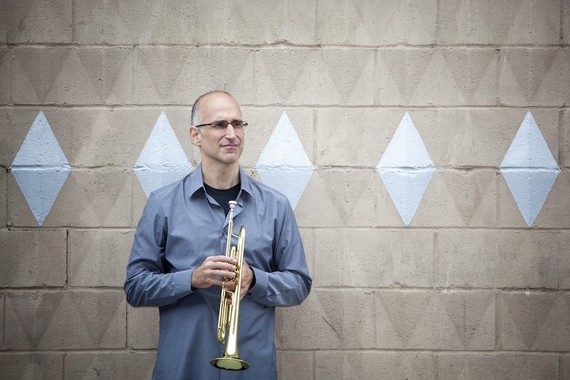 Ralph Alessi holds his trumpet