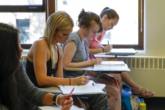 Comm-Studies undergrads sitting at desks in a classroom