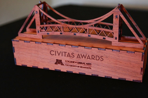 Close up of a Civitas Award. It's a small wooden bridge.