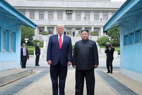 US president Donald Trump stands together with North Korean supreme leader Kim Jung Un in the Korean Demilitarized Zone