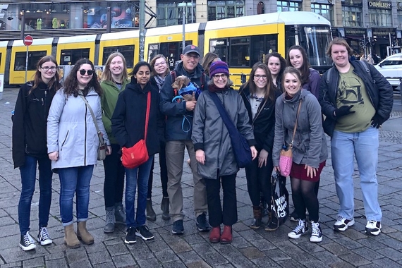11 Students and professor in Berlin in front of an urban commuter train