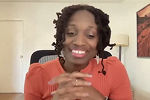 Screenshot of playwright Aleshea Harris in home office on Zoom