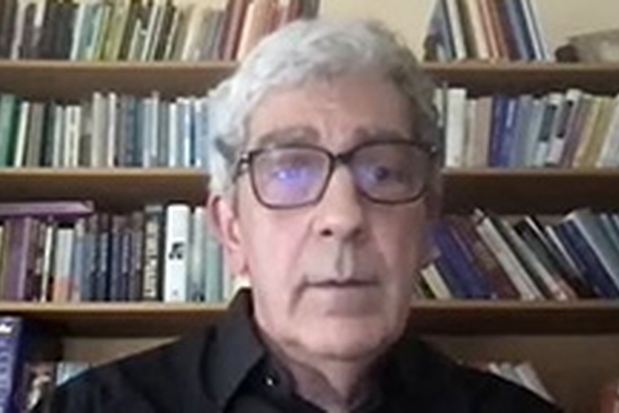 Screenshot of Prof Timothy Brennan in home office on Zoom