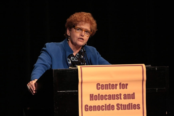 Deborah Lipstadt speaking at a podium for the Center for Holocaust and Genocide Studies