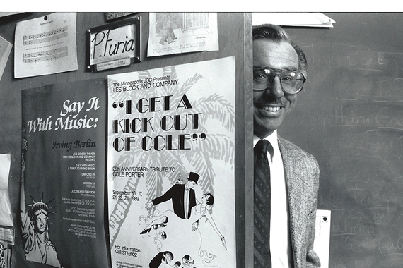 Professor Philip Furia looking out from his office with Cole Porter poster on door