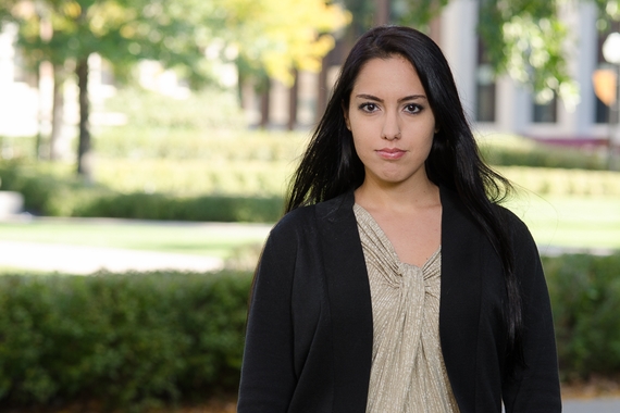 Photo of student Sarah Abdella-El Kallassy. She is outdoors and is looking at the camera in the photo.