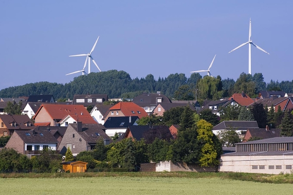 Windmills behind houses in Germany