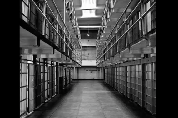 Photo of prison bars, black and white