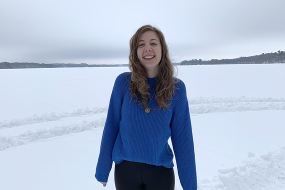 Photo of English major Hannah Haakenson standing on frozen lake 