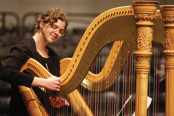 Woman playing harp