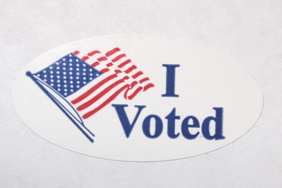 A sticker with an American Flag cartoon and the words "I Voted"